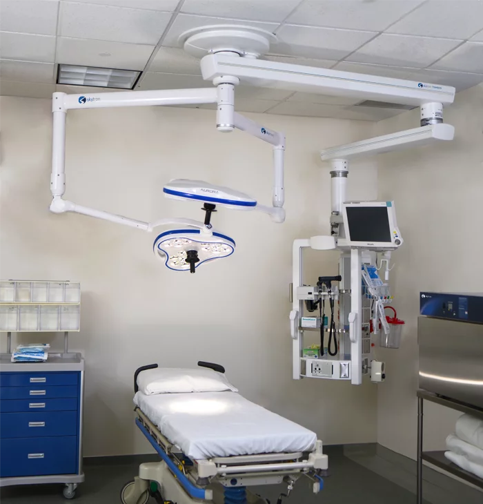 Skytron Aurora Astro surgical light above bed in medical setting