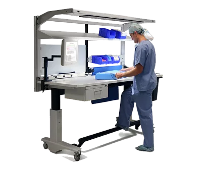 Skytron ErgoStat Prep & Pack Workstation in use by medical personnel in scrubs, no background