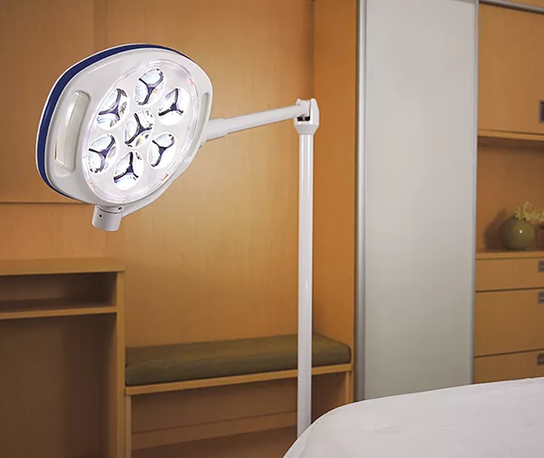 Skytron Spectra exam light on a stand next to near patient bed